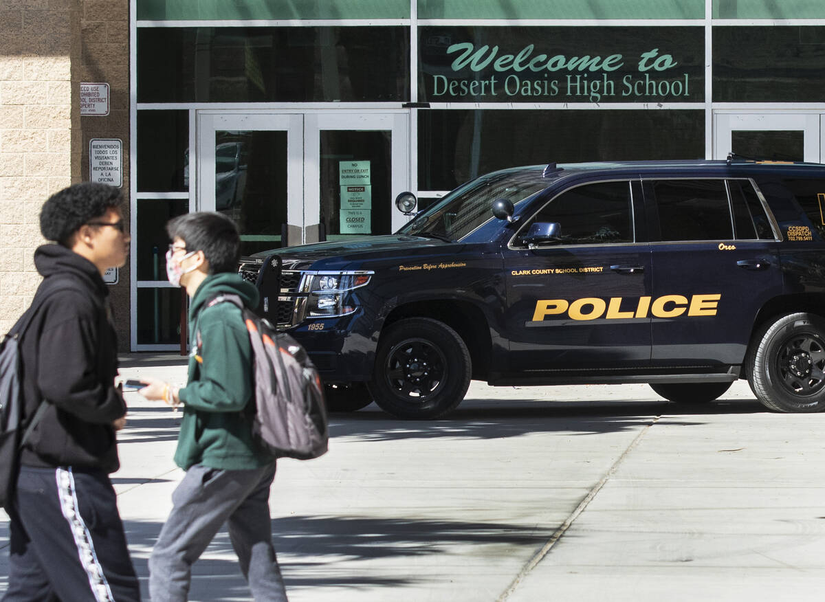 A Clark County School District police vehicle is seen as students at Desert Oasis High School l ...