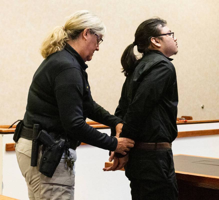 Brandon Iglesias, center, is led out of the courtroom after his sentencing at North Las Vegas J ...