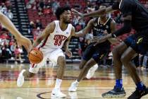 UNLV Rebels guard EJ Harkless (55) drives toward the hoop against San Jose State Spartans guard ...