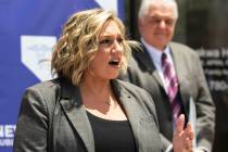 State Majority Leader Nicole Cannizzaro speaks as Gov. Steve Sisolak looks on, on Wednesday, Ju ...