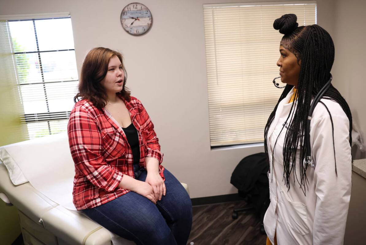 Lilnetra Grady, chief medical officer at FirstMed Health and Wellness Center, right, talks with ...