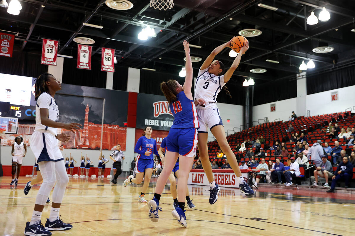 Centennial's Charlece Ohiaeri (3) grabs a pass under pressure from Reno's Kirsten Martin (10) d ...
