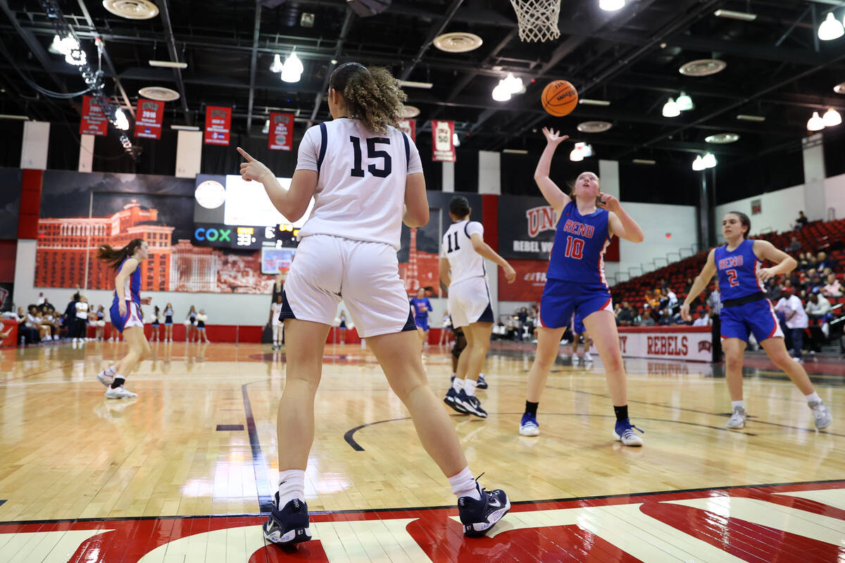 Centennial's Jada Price (15) reacts after scoring a basket against Reno during a girls class 5A ...