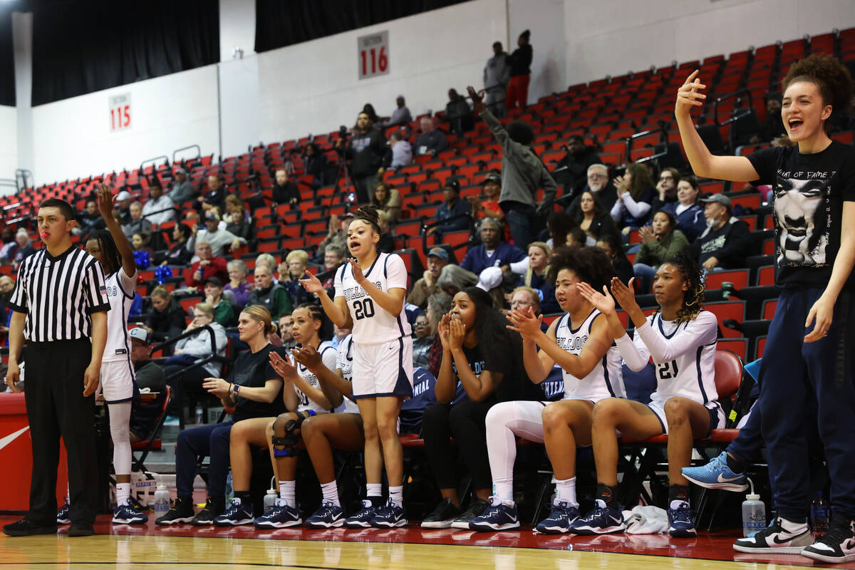 The Centennial bench reacts after a play during a girls class 5A state semifinal game against R ...