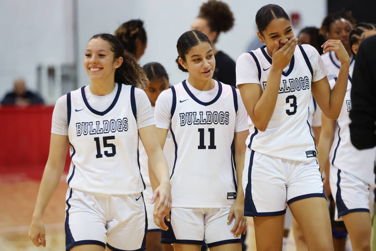 Centennial players celebrate their win against Reno during a girls class 5A state semifinal gam ...
