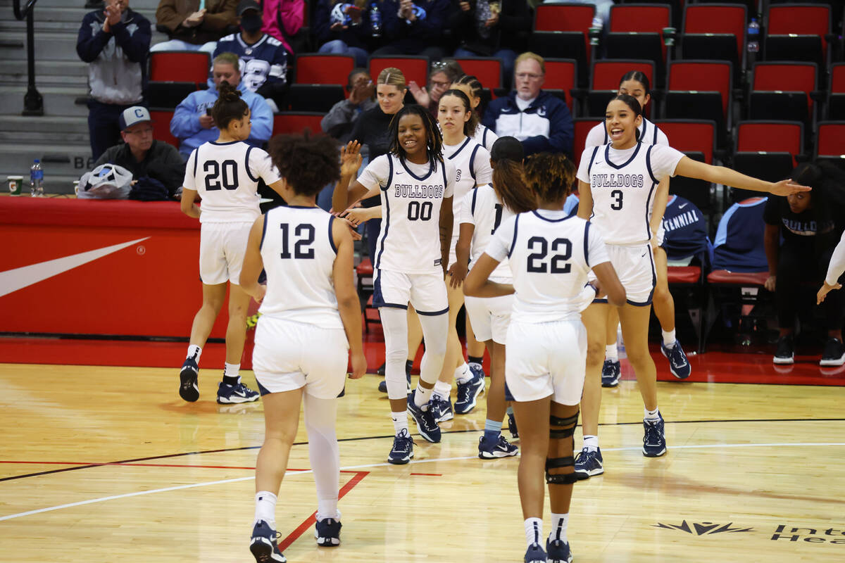 Centennial players celebrate their win against Reno during a girls class 5A state semifinal gam ...