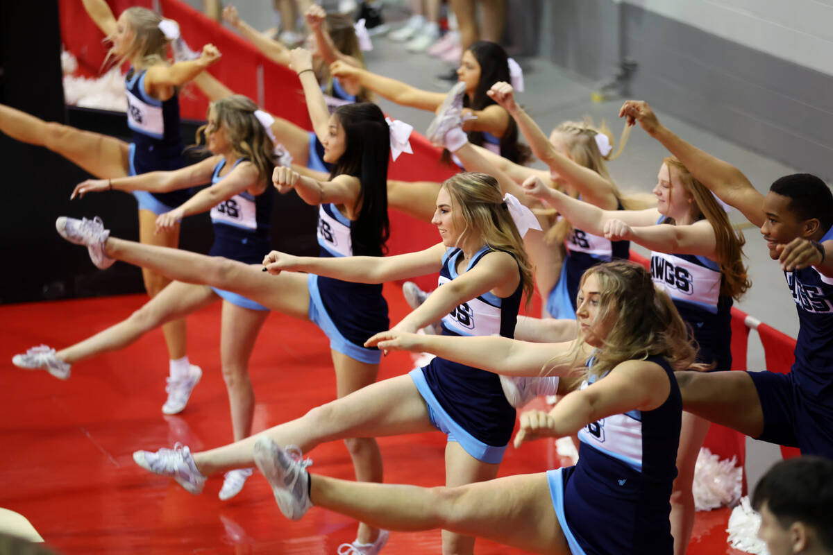 Cheerleaders perform during a girls class 5A state semifinal game between Centennial and Reno a ...