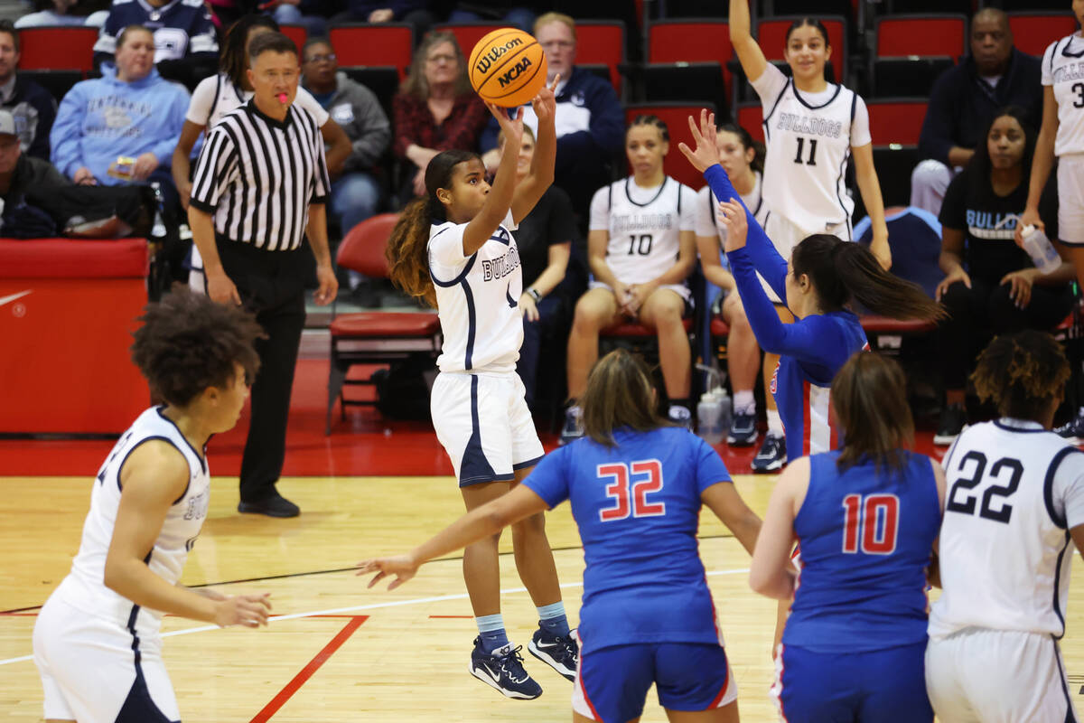 Centennial's Azaia Tatum (1) takes a shot against Reno during a girls class 5A state semifinal ...