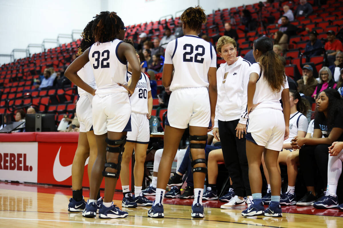Centennial's head coach Karen Weitz talks to her players during a timeout in a girls class 5A s ...
