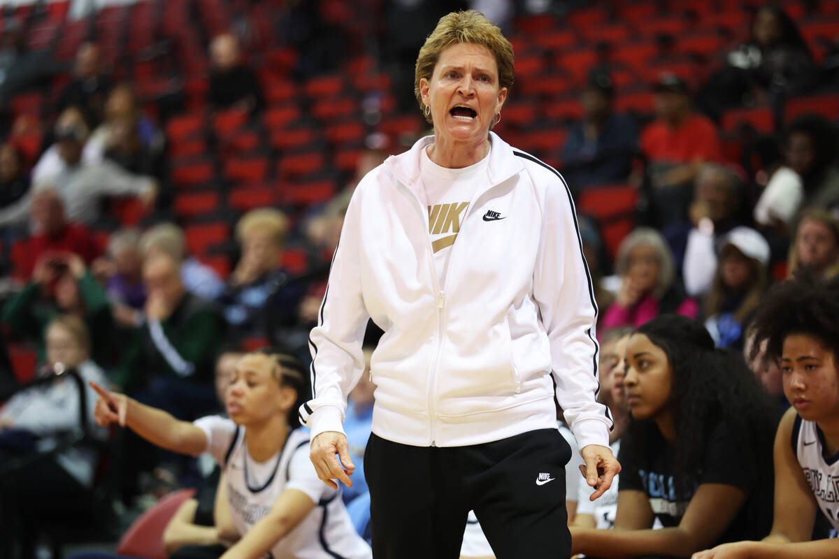 Centennial's head coach Karen Weitz talks to her players during a girls class 5A state semifina ...
