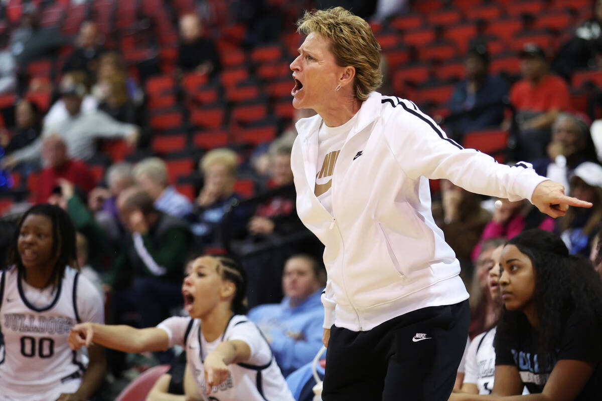 Centennial's head coach Karen Weitz talks to her players during a girls class 5A state semifina ...