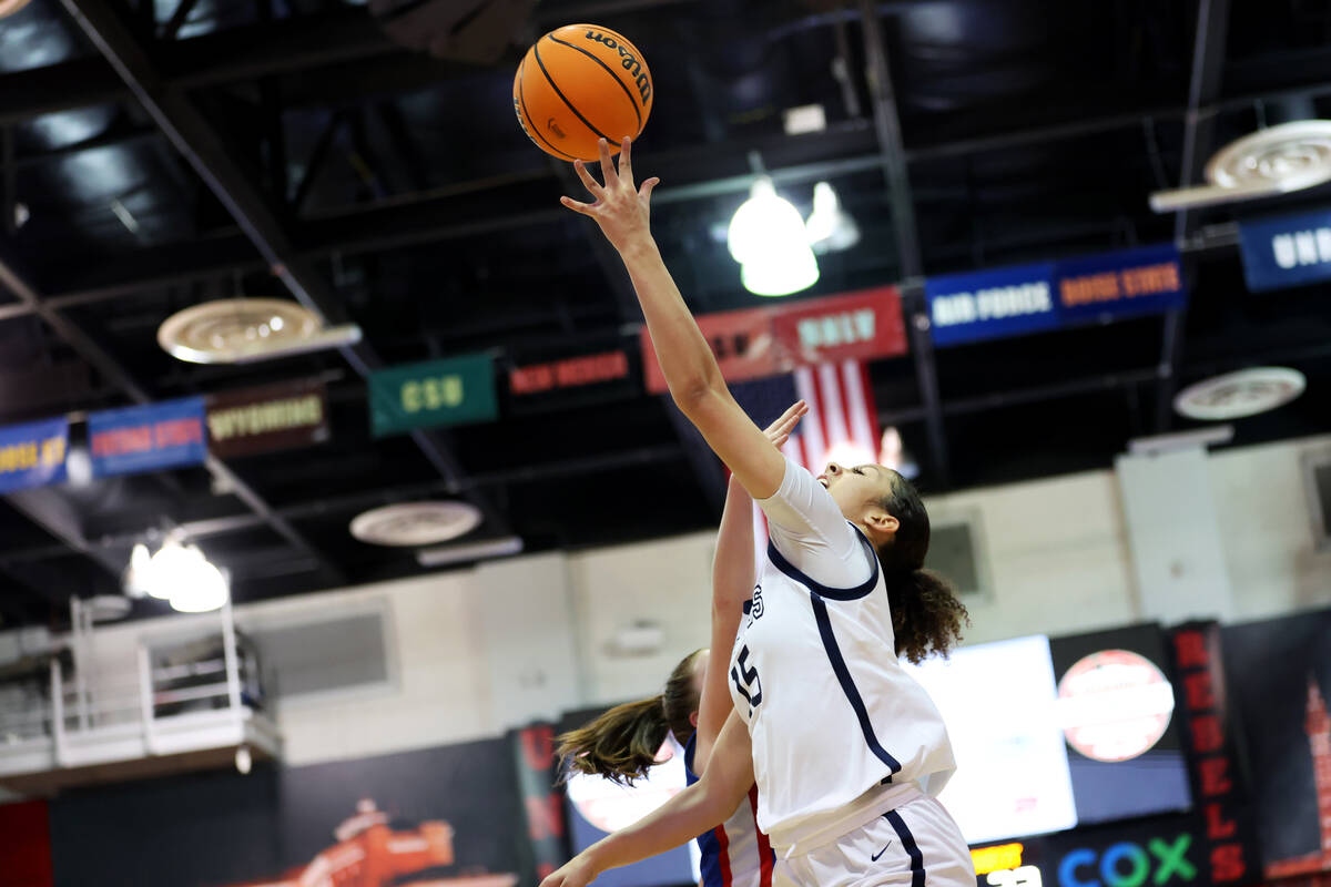 Centennial's Jada Price (10) goes up for a shot against Reno during a girls class 5A state semi ...