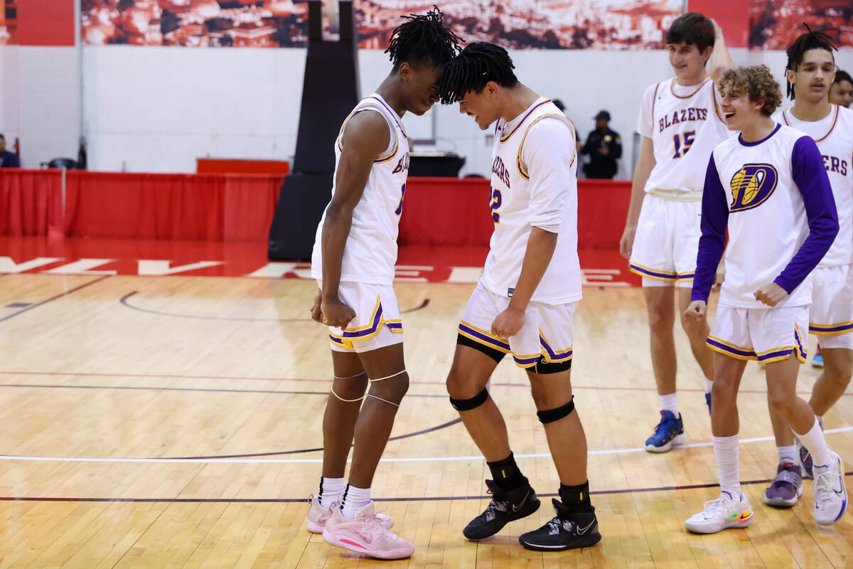 Durango's Tylen Riley (10), left, and Michael Bartlett (22) celebrate their win against Douglas ...
