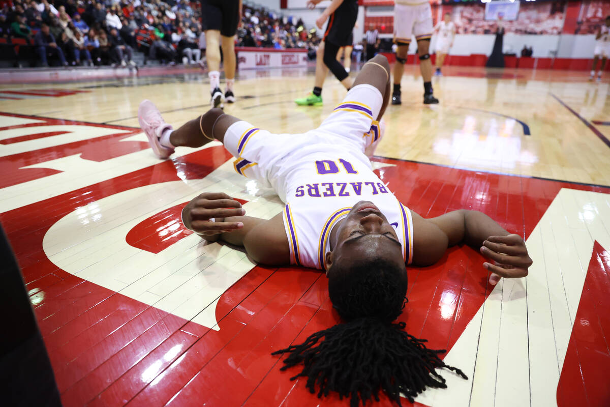 Durango's Tylen Riley (10) takes a fall during a boys class 5A state semifinal game against Dou ...