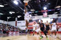 Durango's Jevon Yapi (3) lays up the ball for a score against Douglas during a boys class 5A st ...