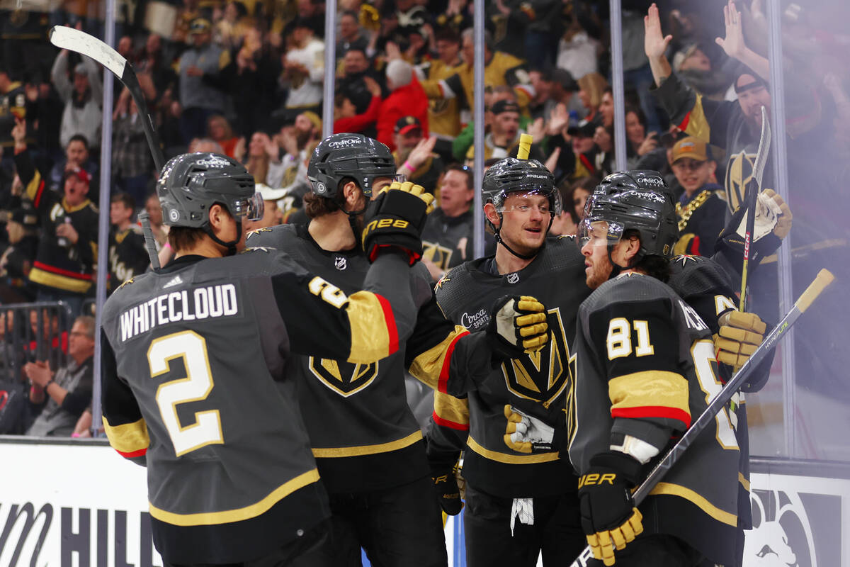 The Vegas Golden Knights celebrate a goal by center Paul Cotter (43) during the first period of ...