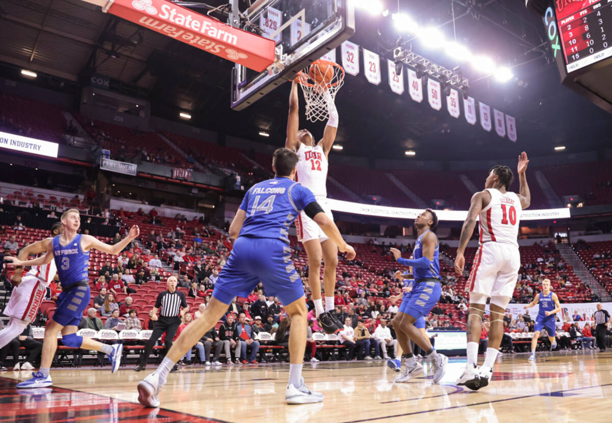 UNLV center David Muoka (12) dunks the ball against the Air Force Falcons during the first half ...