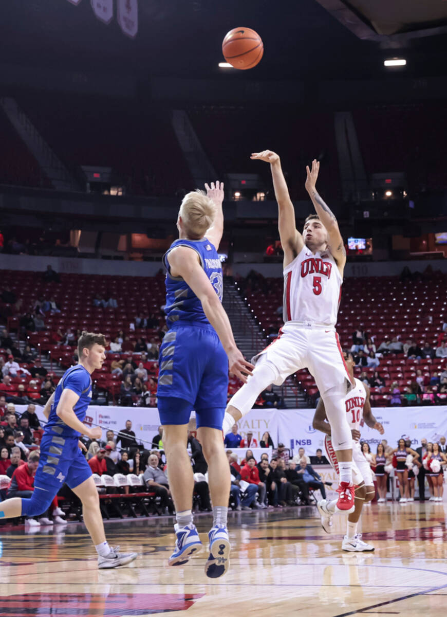 UNLV guard Jordan McCabe (5) shoots over Air Force Falcons forward Rytis Petraitis (31) during ...