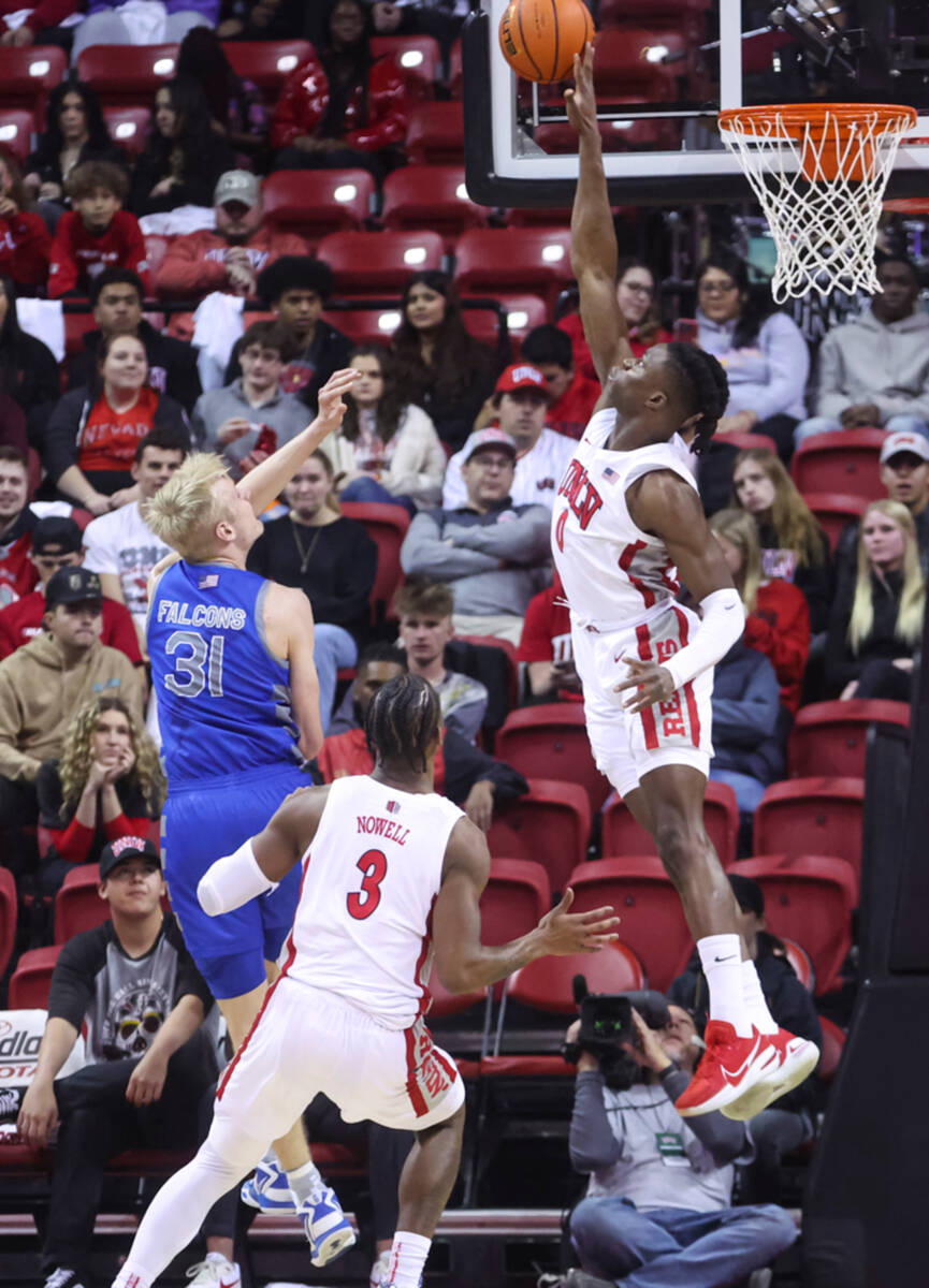 UNLV forward Victor Iwuakor (0) blocks a shot from Air Force Falcons forward Rytis Petraitis (3 ...