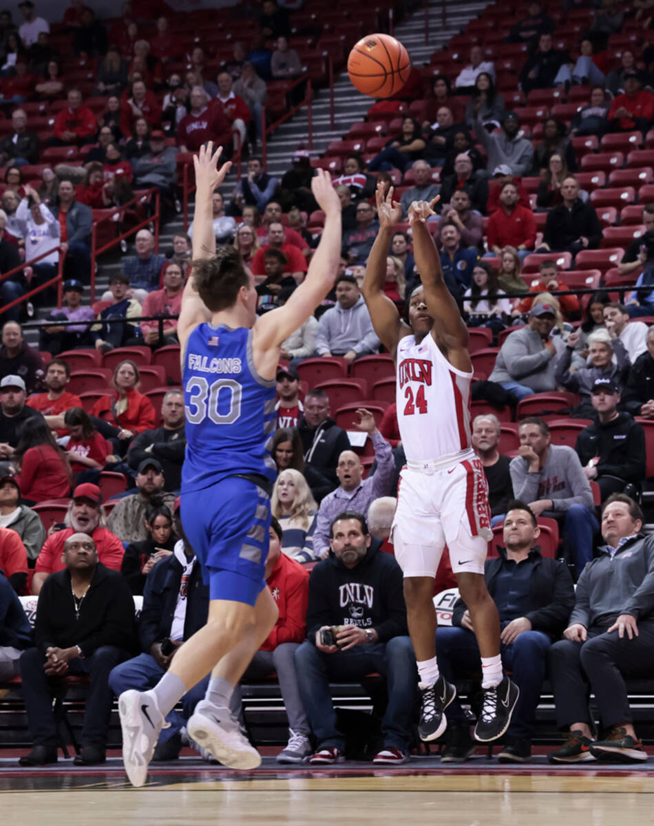 UNLV guard Jackie Johnson III (24) shoots over Air Force Falcons guard Camden Vander Zwaag (30) ...