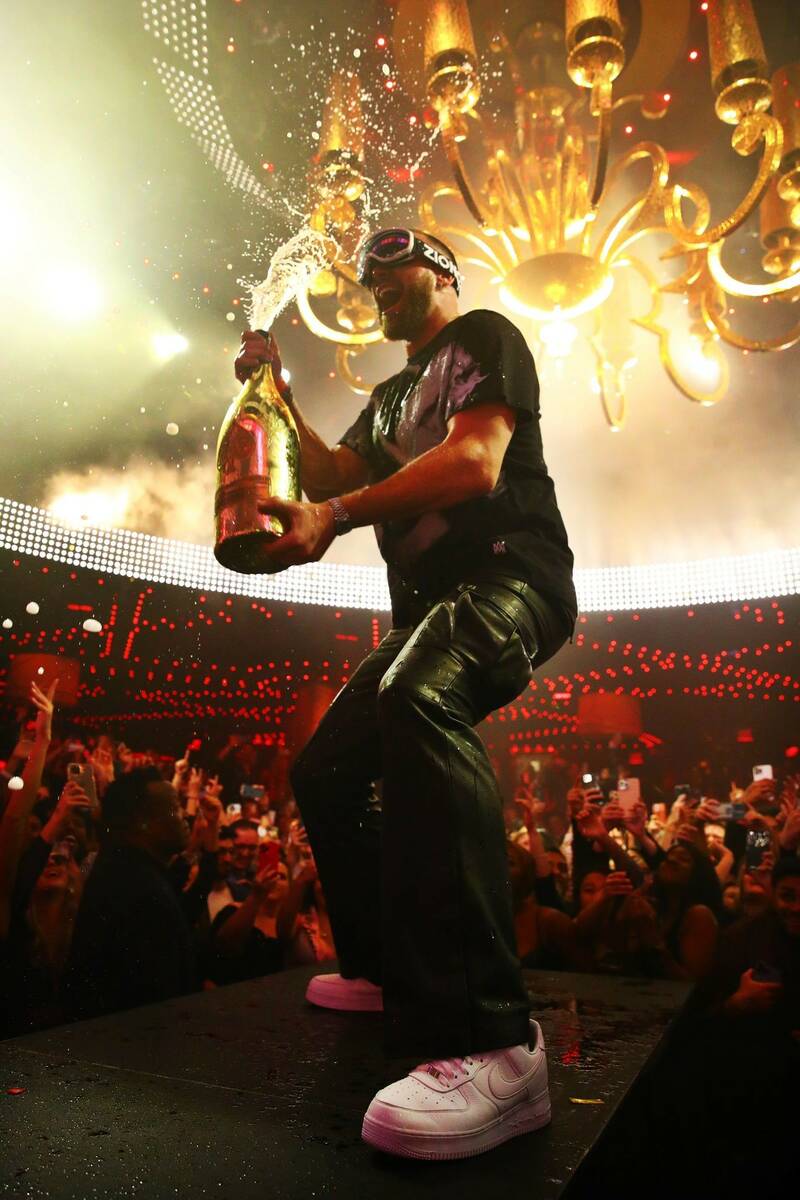Travis Kelce Sprays 6-liter of Ace of Spades Champagne on the sold-out crowd at the XS Nightclu ...