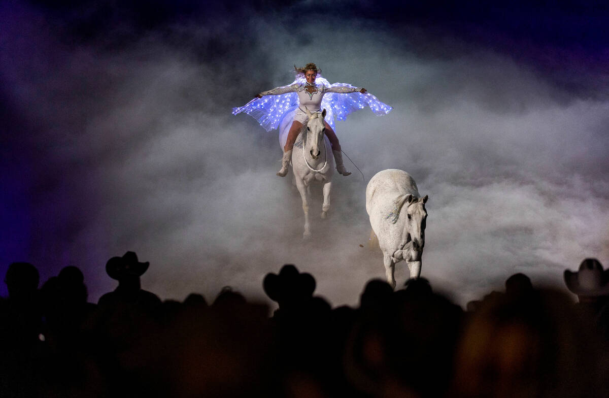 Trick and Roman rider Jessica Fowlkes follows a horse about a smoke-filled ring during a memori ...