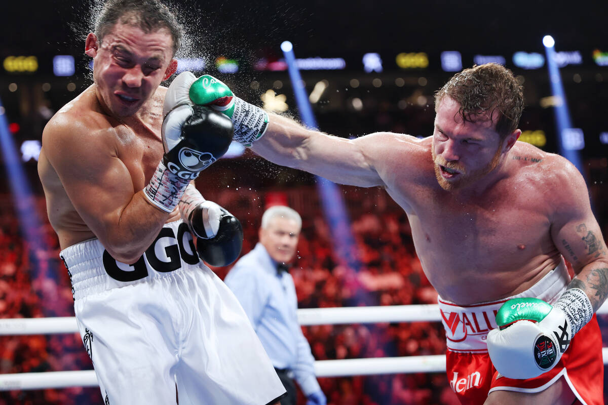 Saul "Canelo" Alvarez, right, connects a punch against Gennadiy "GGG" Golovkin, in the fifth ro ...