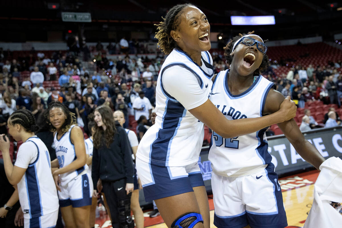 Centennial’s Kaliyah Dillard, left, and Asani Ceaser celebrate seconds after winning the ...