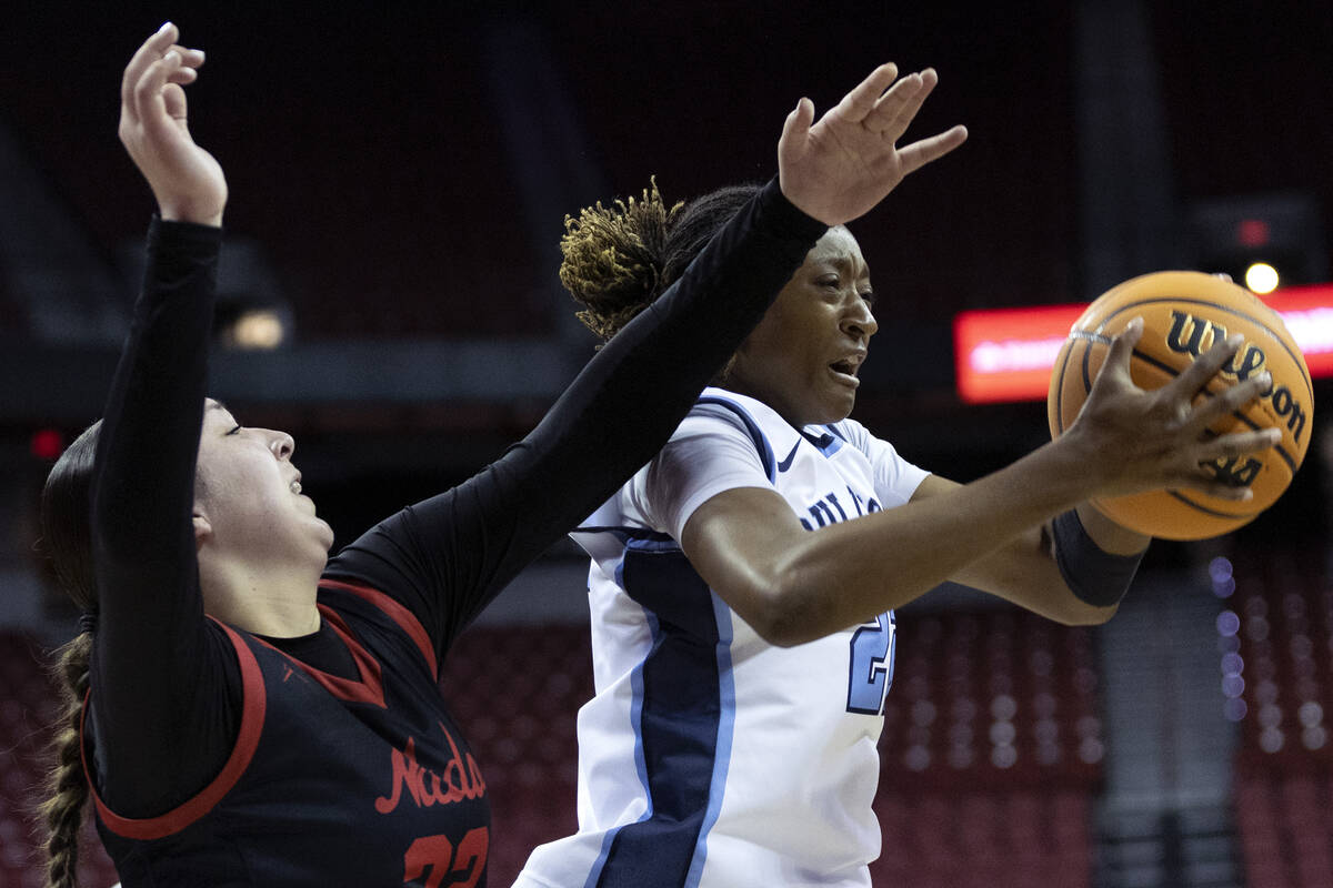 Centennial’s Kaliyah Dillard (22) shoots against Coronado’s AJ Wick (22) during t ...