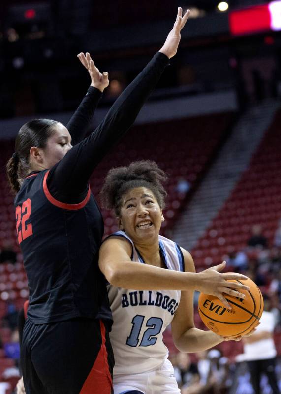 Centennial’s Ayla Williams (12) shoots against Coronado’s AJ Wick (22) during the ...