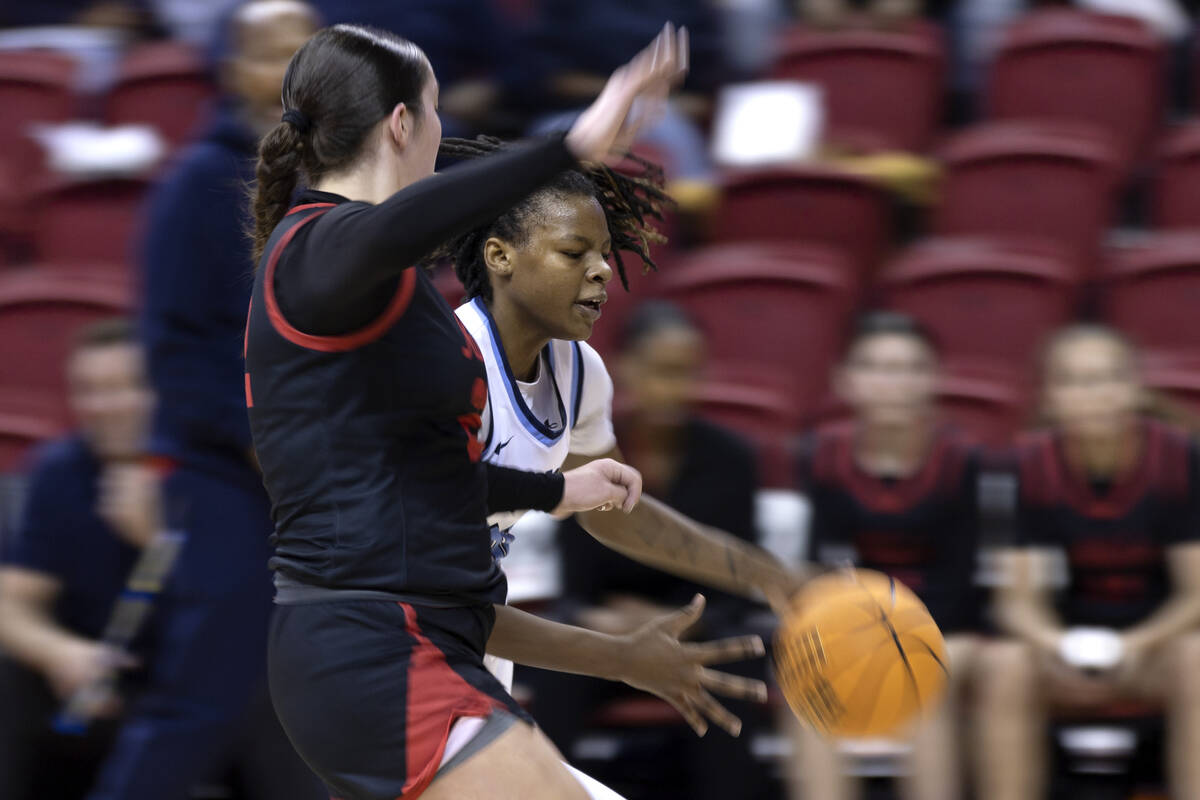 Centennial’s Kaniya Boyd dribbles up the court against Coronado’s AJ Wick during ...