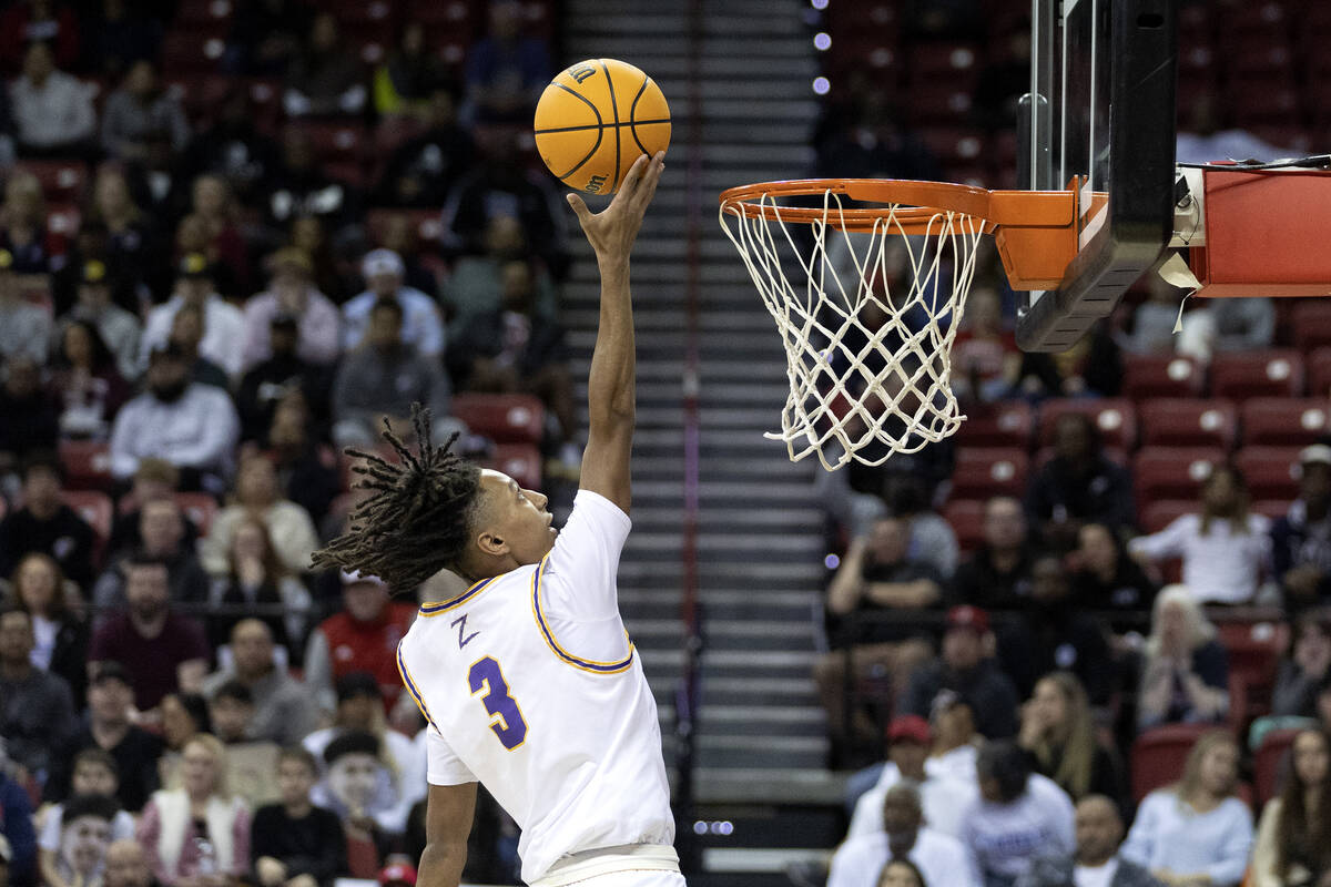 Durango’s Jevon Yapi (3) shoots during the first half of a Class 5A boys high school bas ...