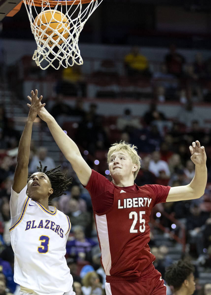 Durango’s Jevon Yapi (3) shoots against Liberty’s Tyler Bright (25) during the se ...