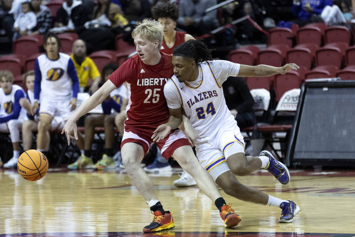 Liberty’s Tyler Bright (25) dribbles against Durango’s Taj Degourville (24) durin ...
