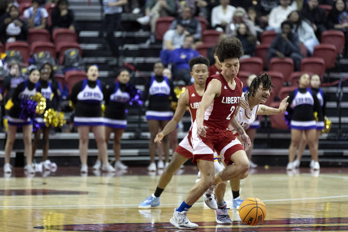 Liberty’s Angelo Kambala (2) steals possession from Durango’s Jevon Yapi (3) duri ...