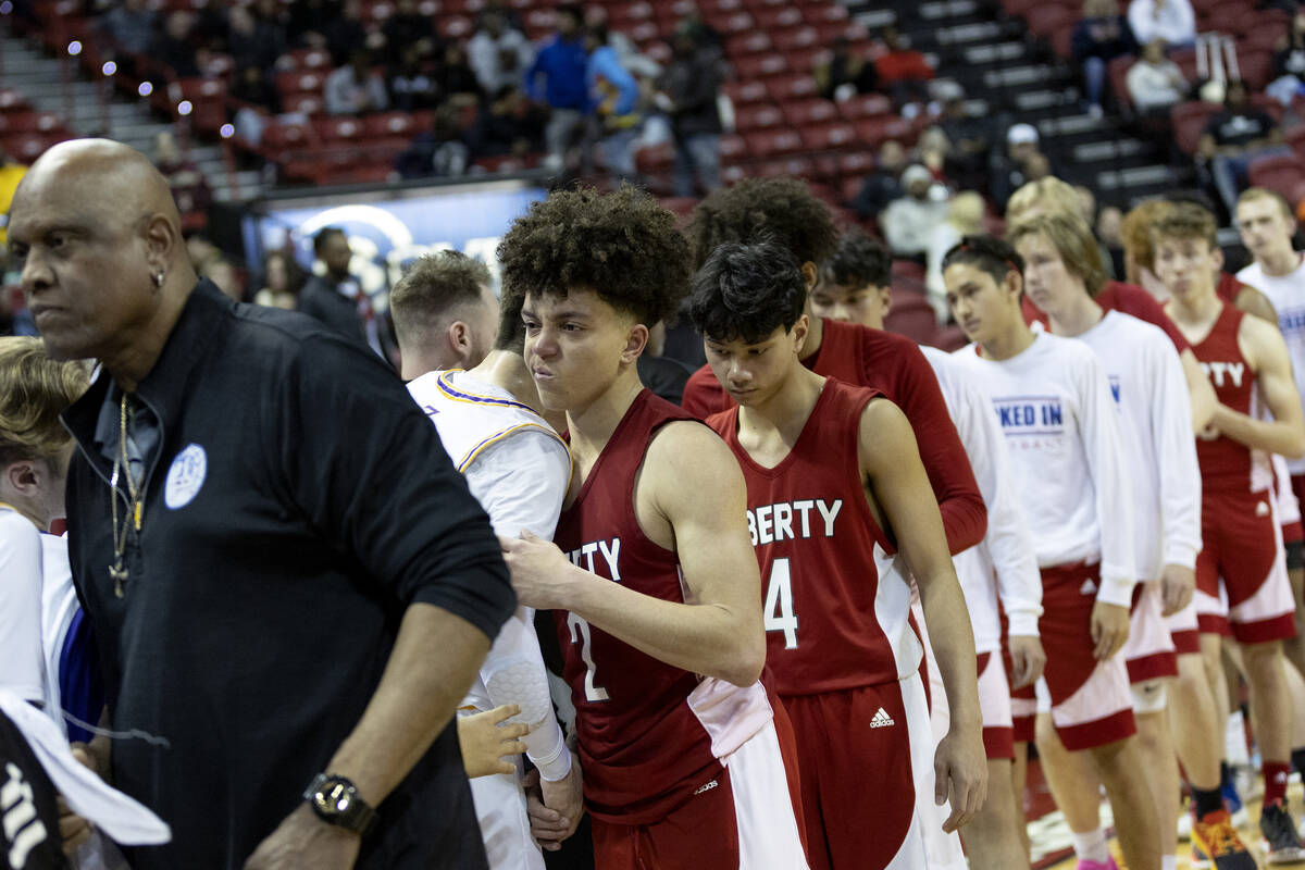 Liberty shakes hands with Durango after losing to them in the Class 5A boys high school basketb ...