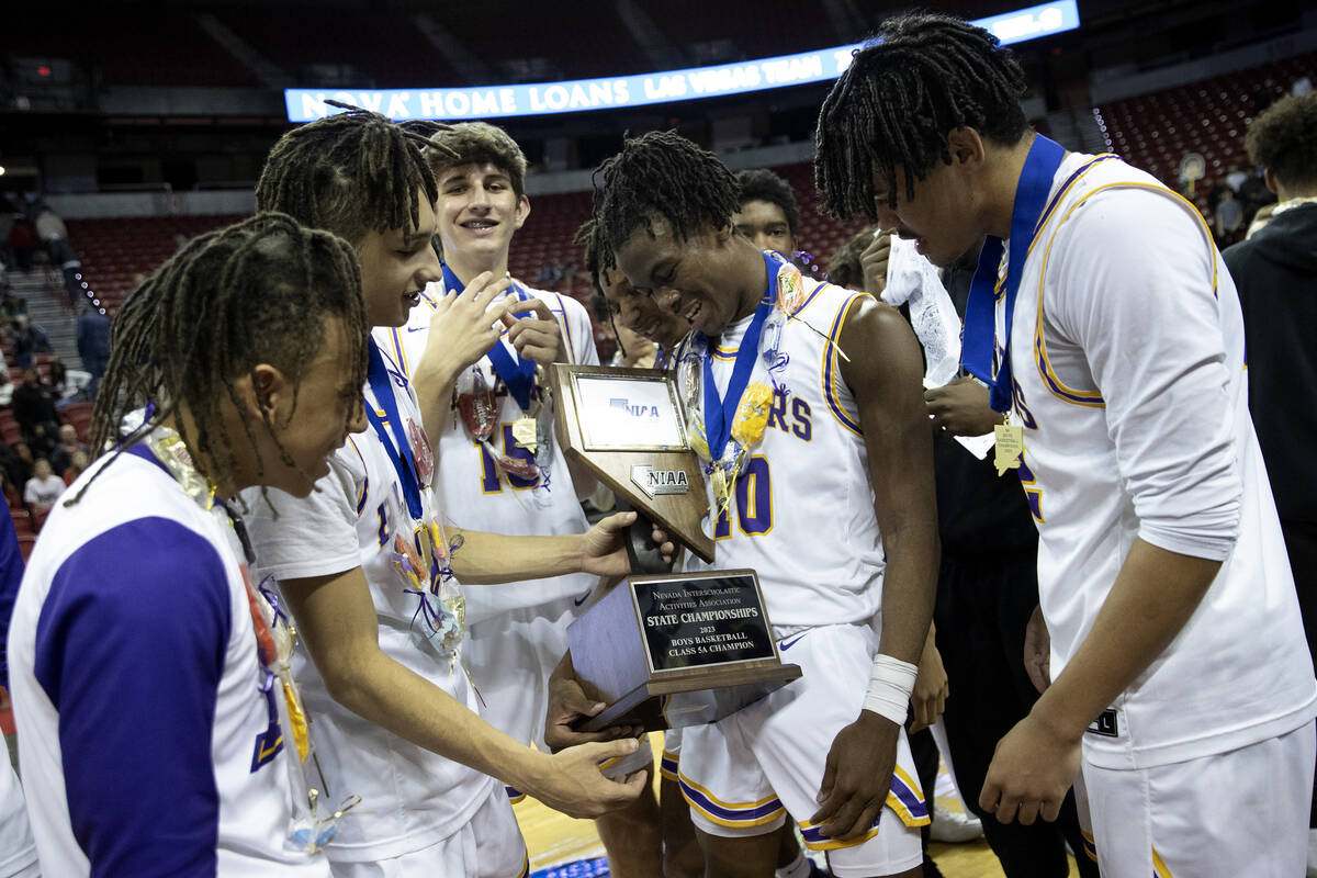 Durango’s Tylen Riley admires the NIAA Class 5A boys high school basketball state champi ...