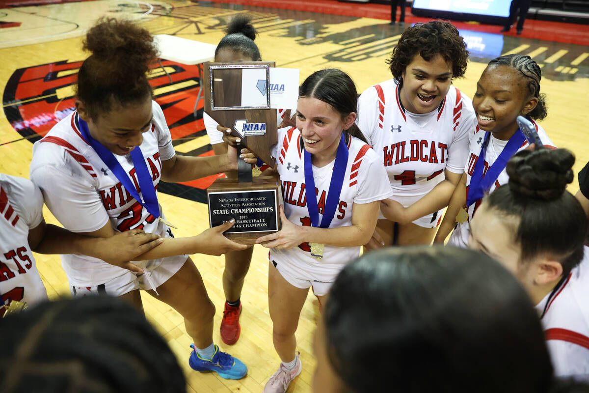 Las Vegas celebrates after defeating Desert Pines in the class 4A girls high school basketball ...