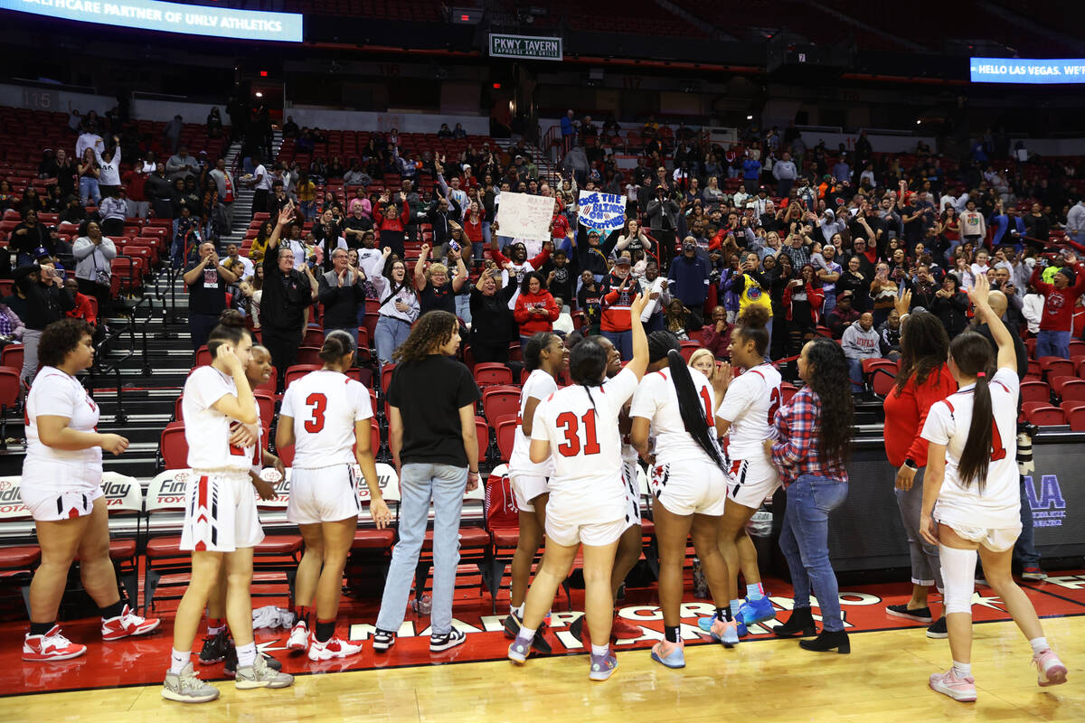 Fans cheer after Las Vegas defeated Desert Pines in the class 4A girls high school basketball s ...