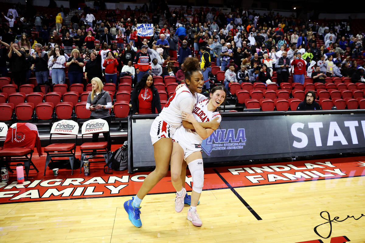 Las Vegas' Layla Faught (1) and Kayla Terry (23) celebrate after defeating Desert Pines in the ...