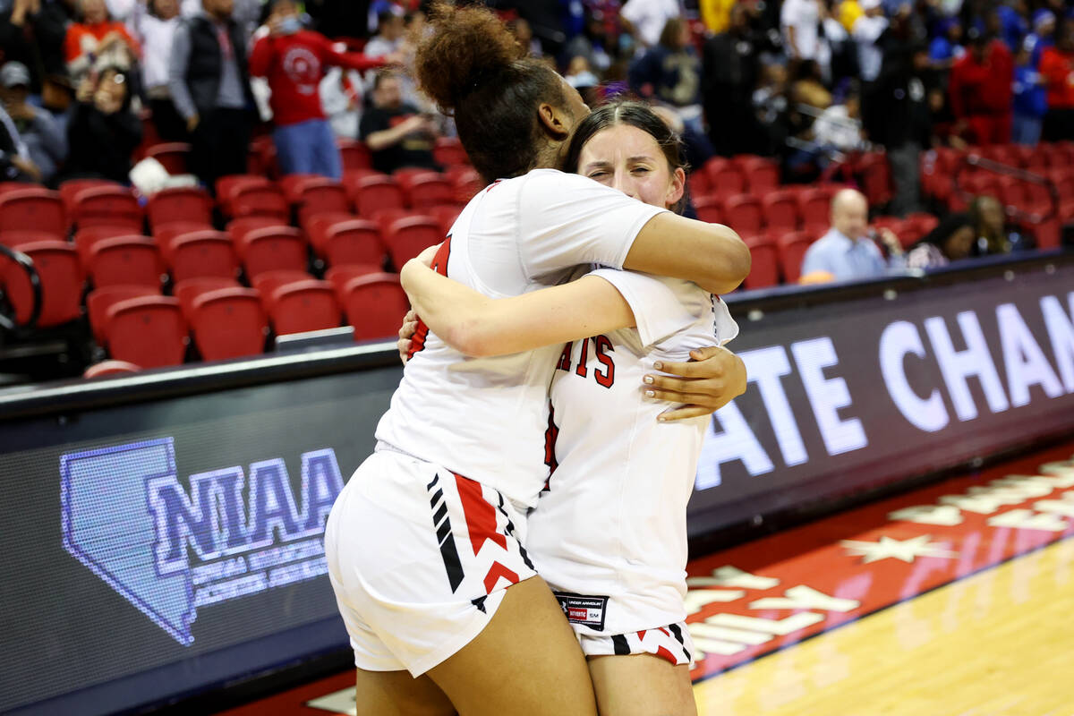Las Vegas' Layla Faught (1) and Kayla Terry (23) celebrate after defeating Desert Pines in the ...