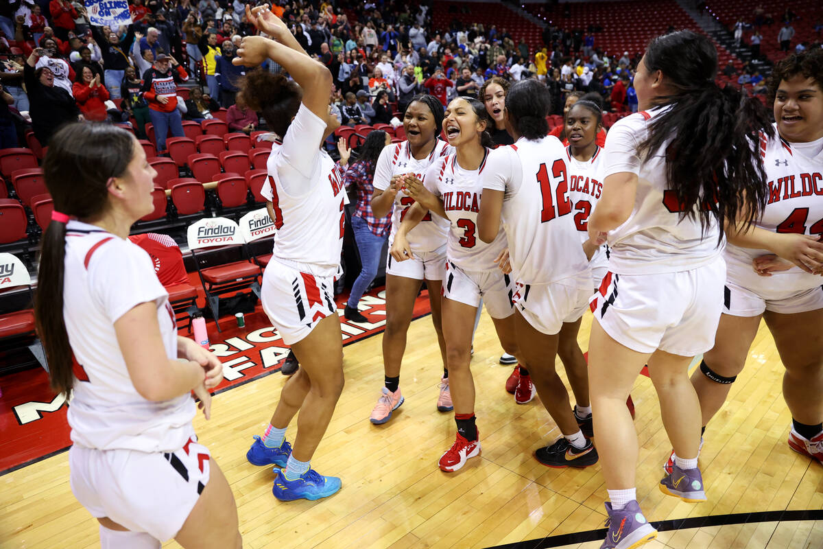 Las Vegas celebrate their victory over Desert Pines in the class 4A girls high school basketbal ...