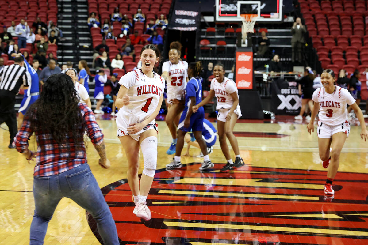 Las Vegas' Layla Faught (1) celebrates with her team after defeating Desert Pines in the class ...