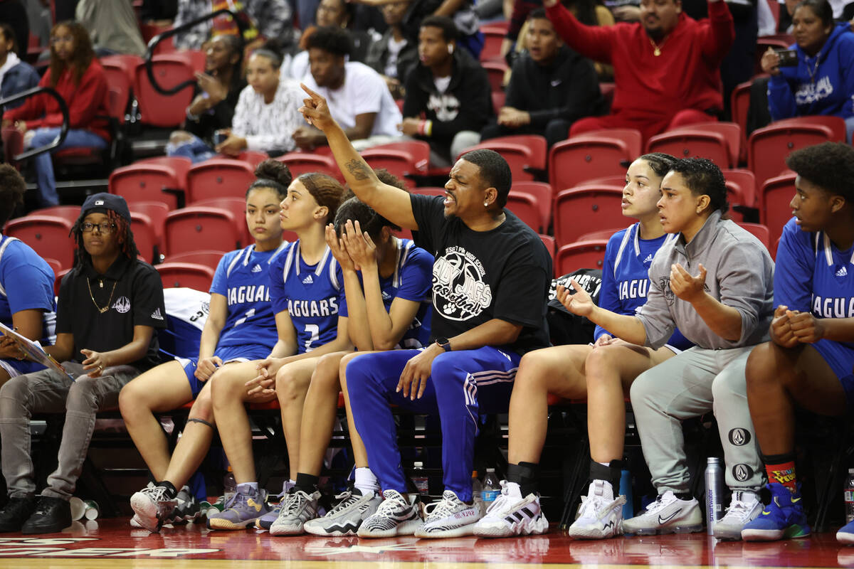 The Desert Pines bench reacts after a play during the class 4A girls high school basketball sta ...