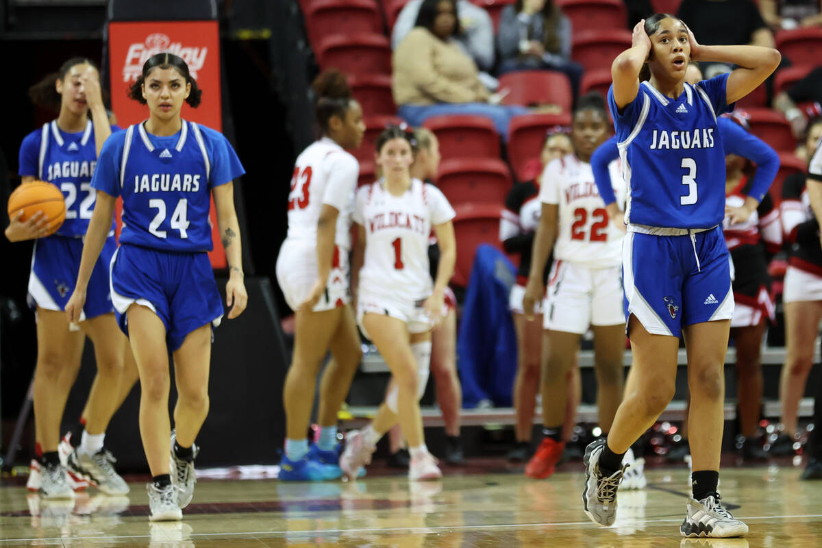 Desert Pines' Tatianna Wilder (3) reacts after a play during the class 4A girls high school bas ...