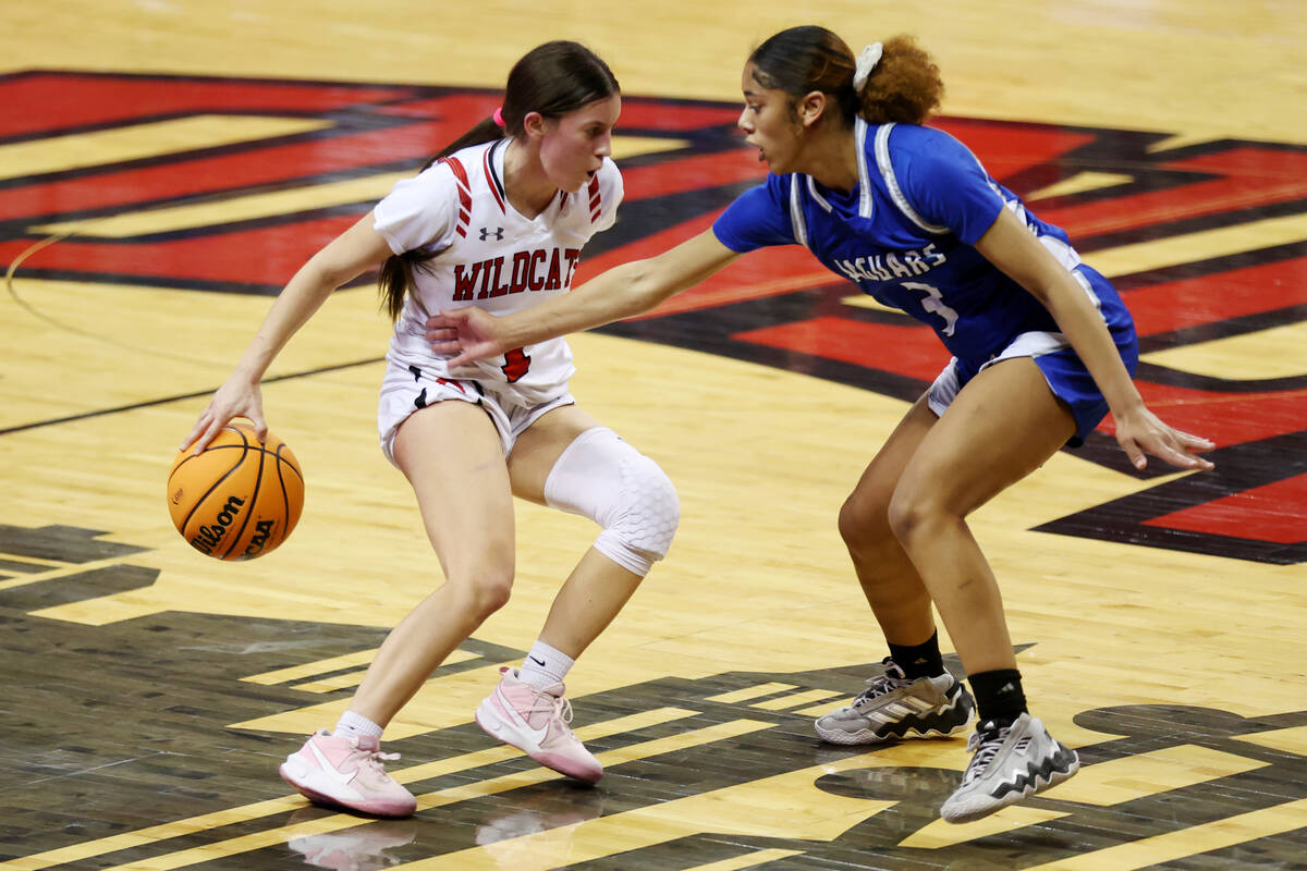 Las Vegas' Layla Faught (1) dribbles the ball away from Desert Pines' Tatianna Wilder (3) durin ...