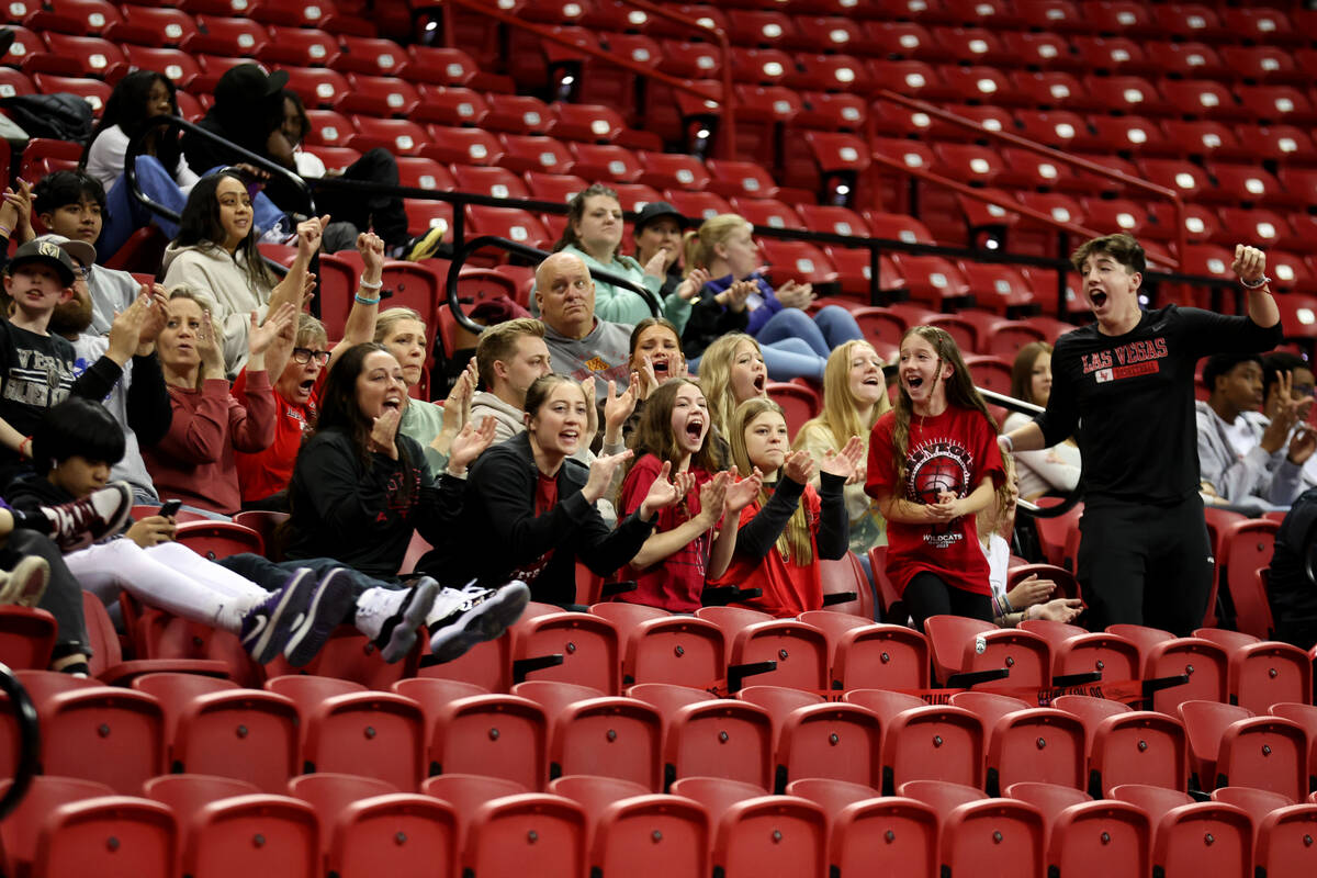 People cheer during the class 4A girls high school basketball state championship game between L ...
