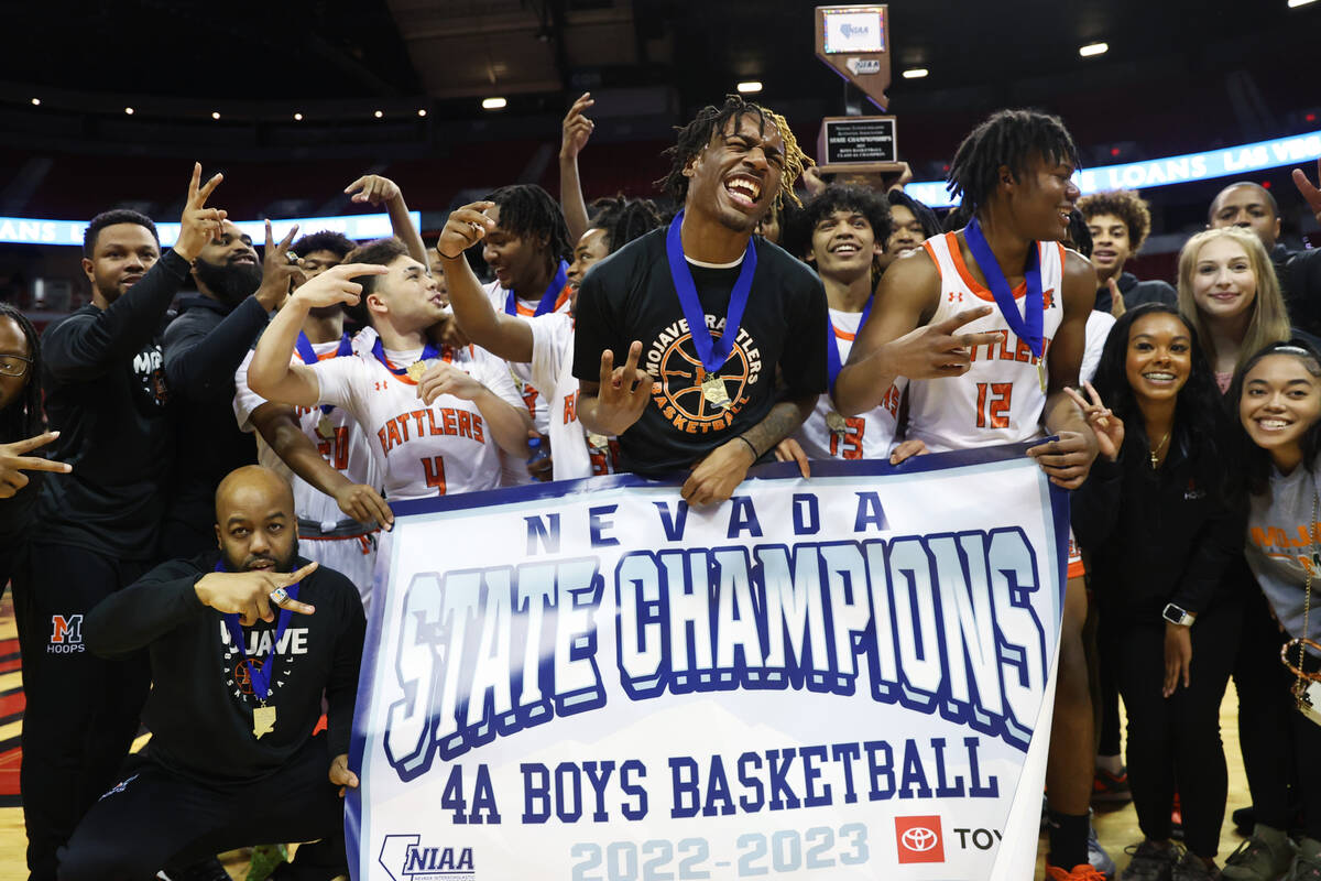 Mojave poses for photos after defeating Silverado in the class 4A boys high school basketball s ...