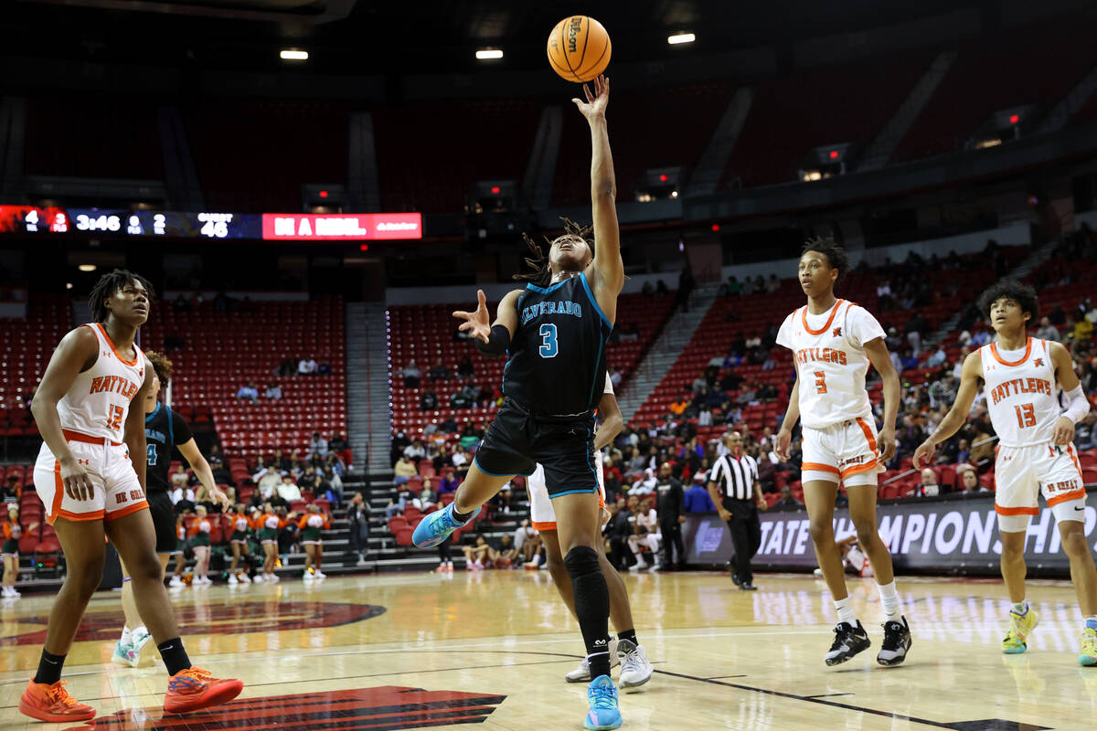 Silverado's Julius Robinson (3) takes a shot against Mojave during the class 4A boys high schoo ...