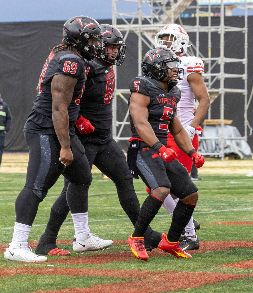 Vegas Vipers running back DeAndre Torrey (5) celebrates his touchdown with teammates Kahlil McK ...